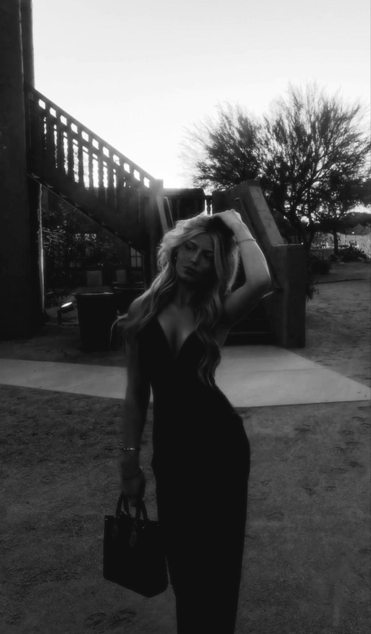 Black and white portrait of Summer in an outdoor fashion look